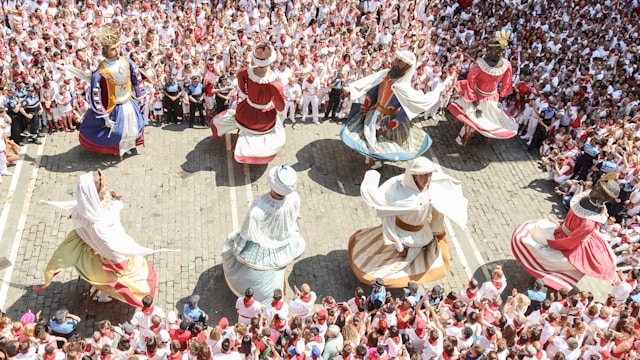 My Kids Running With The Bulls in Pamplona Spain | San Fermín Txikito Giants Parade