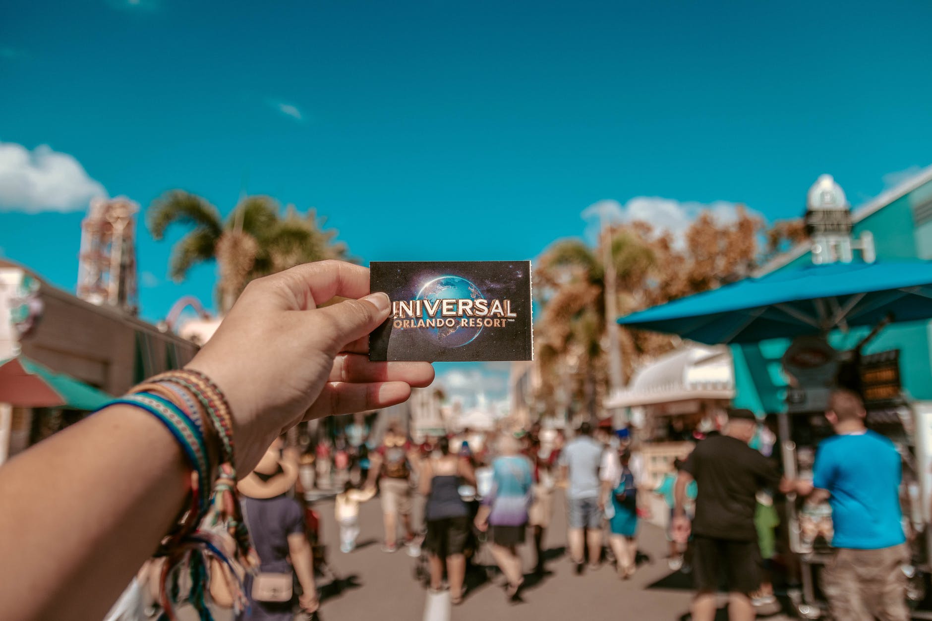 person holding universal studios ticket