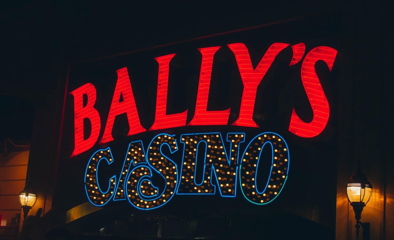 a neon sign for a casino called bally's casino