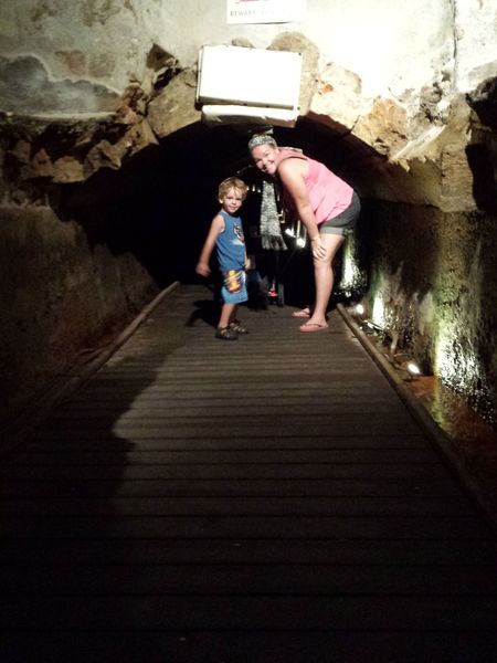 Underground Templar Tunnel passage in Akko with stone walls and dim lighting