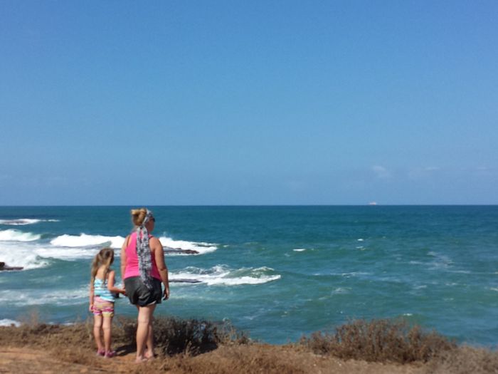 Picnic setup on Dor-Habonim Beach with Mediterranean coastline